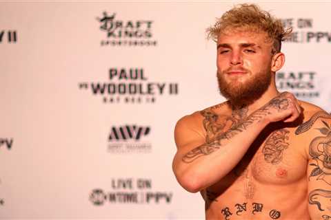 Jake Paul makes throat-slitting gesture during weigh-in for Tyron Woodley rematch and comes in..