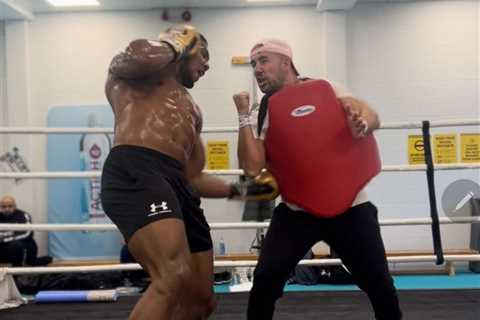 Anthony Joshua shows off ripped body in session with coach Angel Fernandez as part of new training..