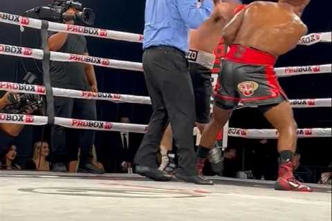 Watch boxer punch referee flush in the face but official takes it like a champ and gets on with job