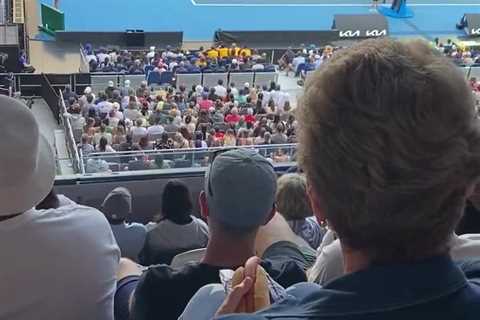 ‘Good lord!’ – Tennis fans split after video of woman eating hot dog in stands at Australian Open..