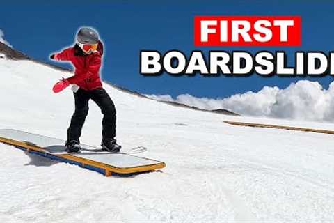 Teaching Snowboarder Her First Boardslide on a Box